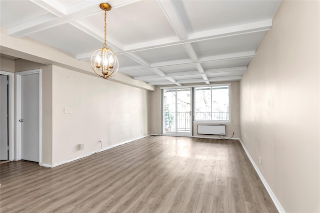 unfurnished room with baseboards, a notable chandelier, light wood-type flooring, beam ceiling, and coffered ceiling