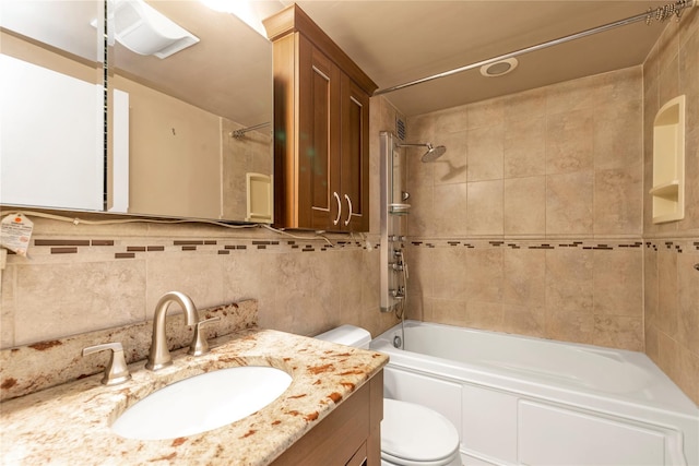 full bath featuring bathing tub / shower combination, tasteful backsplash, vanity, and toilet