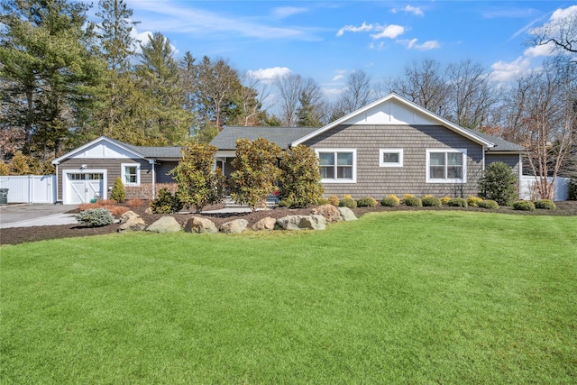 view of front facade featuring concrete driveway, a front lawn, a garage, and fence