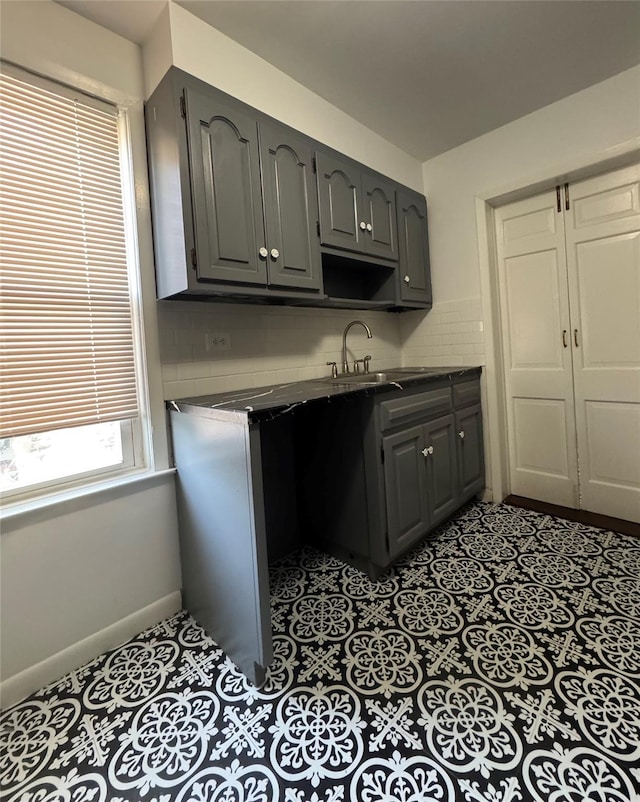 6 Sedgwick Ave, Yonkers, NY 10705 - kitchen featuring a sink, decorative backsplash, gray cabinets, and dark countertops