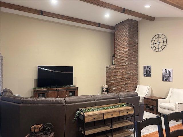 living area featuring beam ceiling, recessed lighting, and wood finished floors