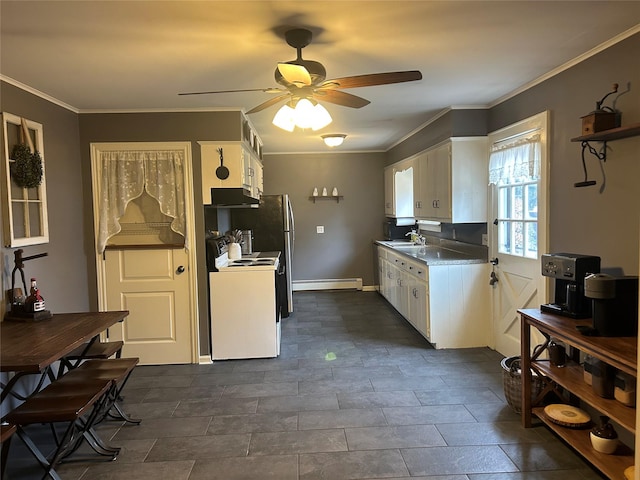 kitchen with white electric range, a baseboard radiator, a ceiling fan, and white cabinetry