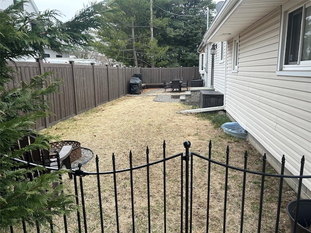 view of yard with a fenced backyard