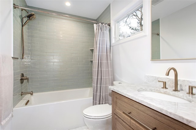 bathroom with vanity, toilet, and shower / bathtub combination with curtain