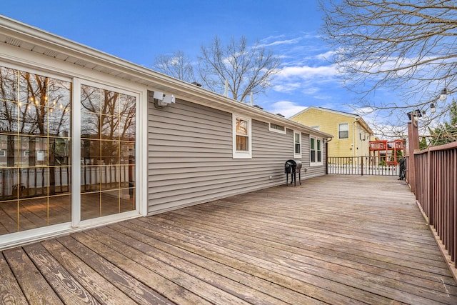 wooden deck with grilling area