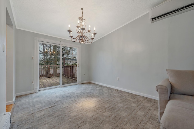 interior space featuring a textured ceiling, a wall unit AC, a notable chandelier, and ornamental molding