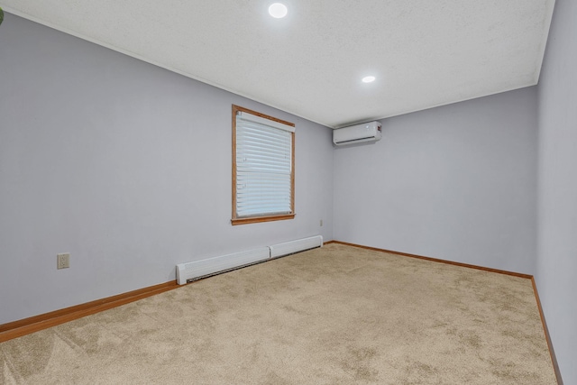 carpeted spare room featuring a baseboard heating unit, baseboards, recessed lighting, a textured ceiling, and a wall mounted AC