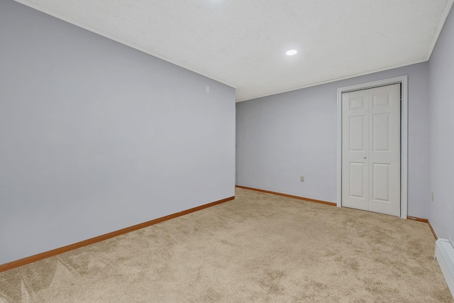 unfurnished room featuring baseboards and carpet floors