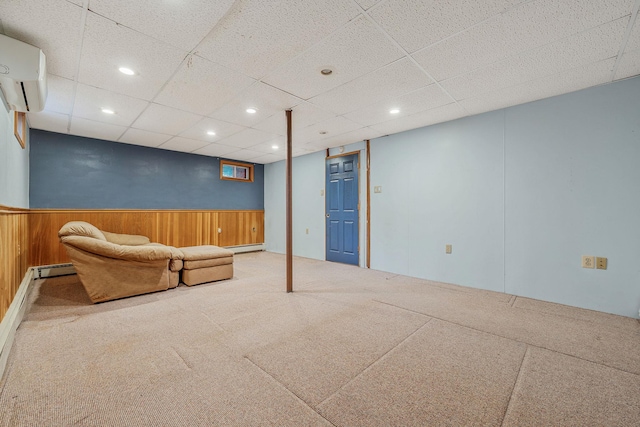 interior space with wooden walls, a wainscoted wall, carpet floors, recessed lighting, and an AC wall unit