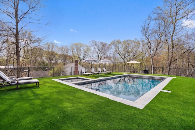 view of swimming pool featuring a lawn, a fenced in pool, and a fenced backyard