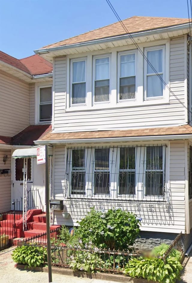 view of front of home with roof with shingles