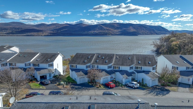 bird's eye view featuring a residential view and a water and mountain view