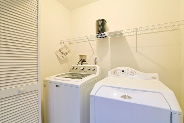 laundry room featuring washer and clothes dryer and laundry area