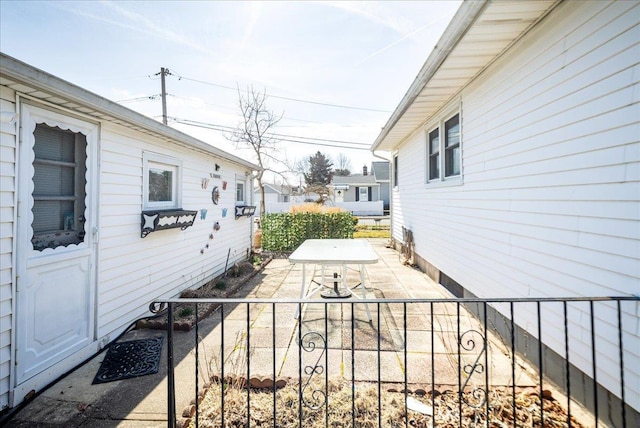 view of patio with outdoor dining space and fence