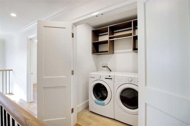 laundry room featuring laundry area, light wood-style flooring, recessed lighting, ornamental molding, and washing machine and dryer