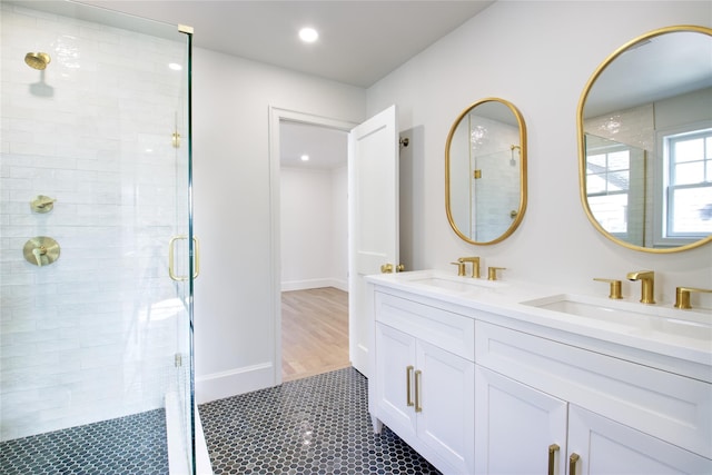 full bath featuring recessed lighting, a stall shower, and a sink
