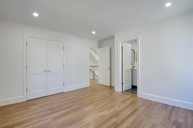 unfurnished bedroom featuring recessed lighting, light wood-type flooring, and ornamental molding