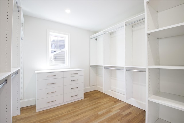 spacious closet with light wood finished floors