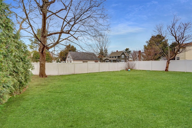 view of yard featuring a fenced backyard