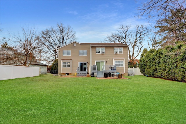 back of property featuring a lawn and a fenced backyard