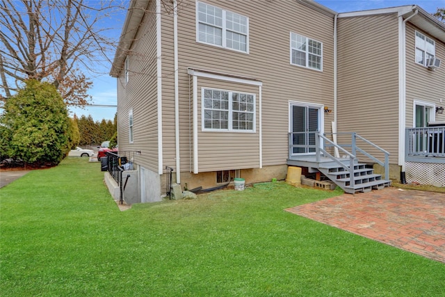 back of house with a patio area and a yard