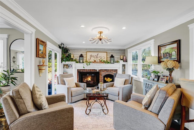 living area featuring recessed lighting, a chandelier, a fireplace, and crown molding