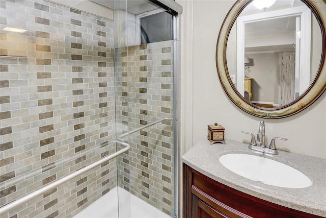 bathroom featuring vanity and a shower stall