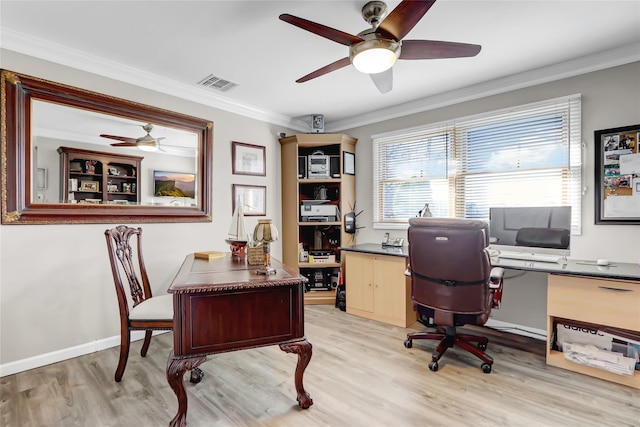 home office featuring visible vents, light wood-style flooring, ceiling fan, and ornamental molding
