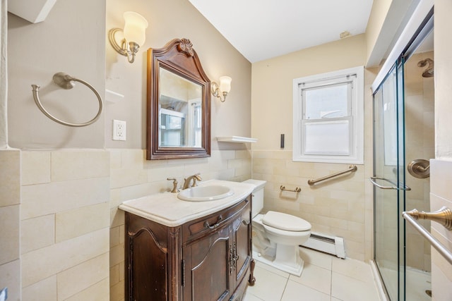 bathroom with a baseboard heating unit, tile walls, a stall shower, and tile patterned floors