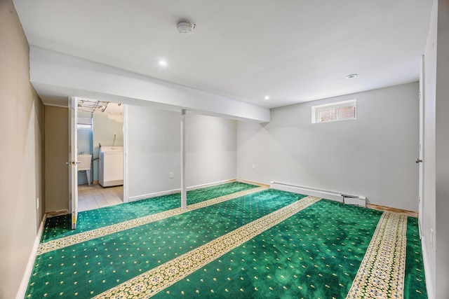 basement with recessed lighting, washer / clothes dryer, baseboards, and a baseboard radiator