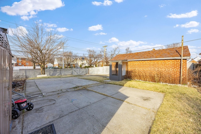 view of patio / terrace featuring a fenced backyard and a residential view