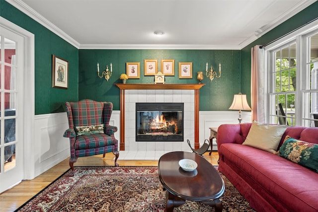 33 Sutherland Dr, Highland Mills, NY 10930 - living area with wood finished floors, a fireplace, ornamental molding, and wainscoting
