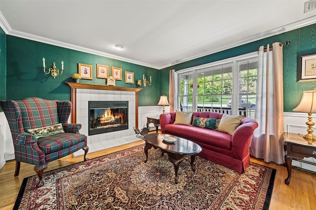 33 Sutherland Dr, Highland Mills, NY 10930 - living area featuring ornamental molding, wood finished floors, and a fireplace