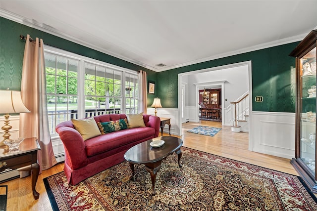 33 Sutherland Dr, Highland Mills, NY 10930 - living room with wood finished floors, ornamental molding, a wainscoted wall, a decorative wall, and stairway