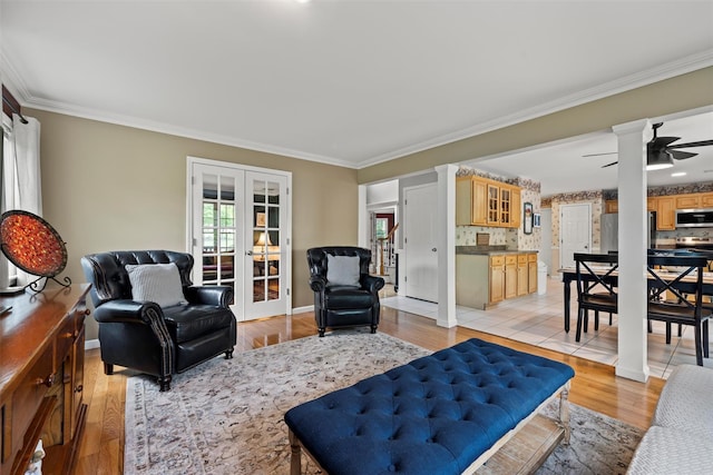 33 Sutherland Dr, Highland Mills, NY 10930 - living area featuring french doors, crown molding, ceiling fan, light wood finished floors, and baseboards
