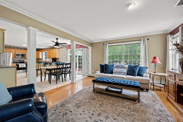 33 Sutherland Dr, Highland Mills, NY 10930 - living area with decorative columns, ceiling fan, crown molding, light wood-style flooring, and baseboard heating