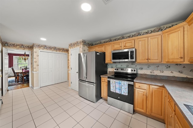33 Sutherland Dr, Highland Mills, NY 10930 - kitchen featuring stainless steel appliances, wallpapered walls, and light tile patterned floors
