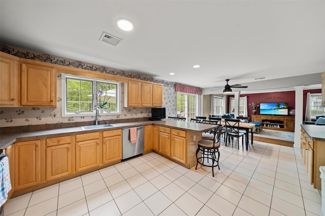 33 Sutherland Dr, Highland Mills, NY 10930 - kitchen featuring dishwasher, a sink, a peninsula, a ceiling fan, and dark countertops