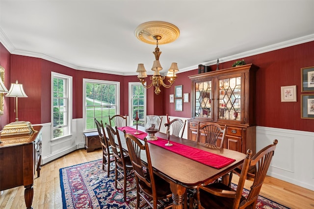 33 Sutherland Dr, Highland Mills, NY 10930 - dining area featuring a chandelier, ornamental molding, light wood-style flooring, and wainscoting