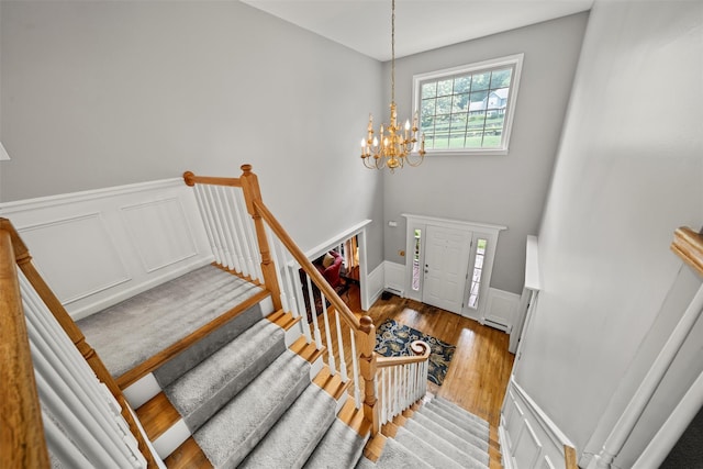 33 Sutherland Dr, Highland Mills, NY 10930 - entryway with a wainscoted wall, a chandelier, a decorative wall, and wood finished floors