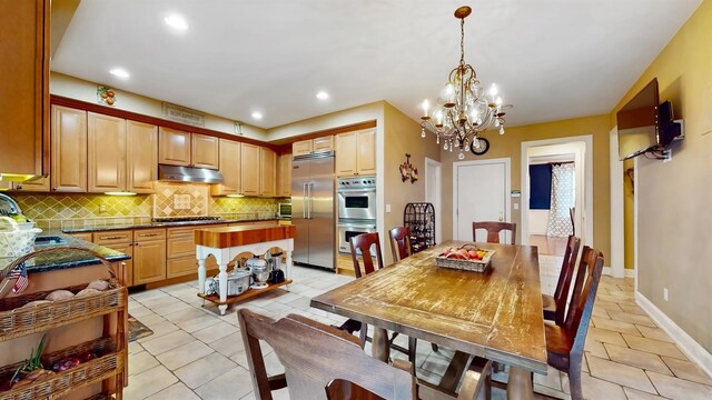 11 Dorian Way, Campbell Hall, NY 10916 - dining room featuring light tile patterned flooring, a chandelier, and recessed lighting