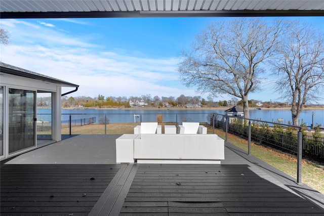 deck featuring a water view and fence