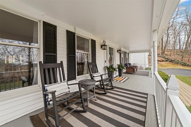 wooden terrace featuring a porch