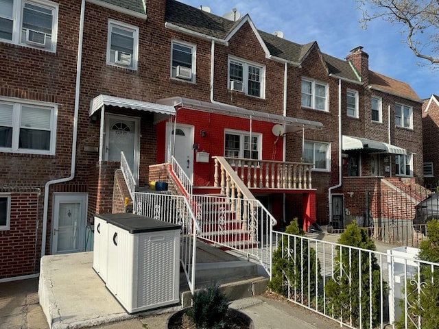 225-23 Murdock Ave, Queens Village, NY 11429 - multi unit property featuring fence, brick siding, a residential view, and stairway