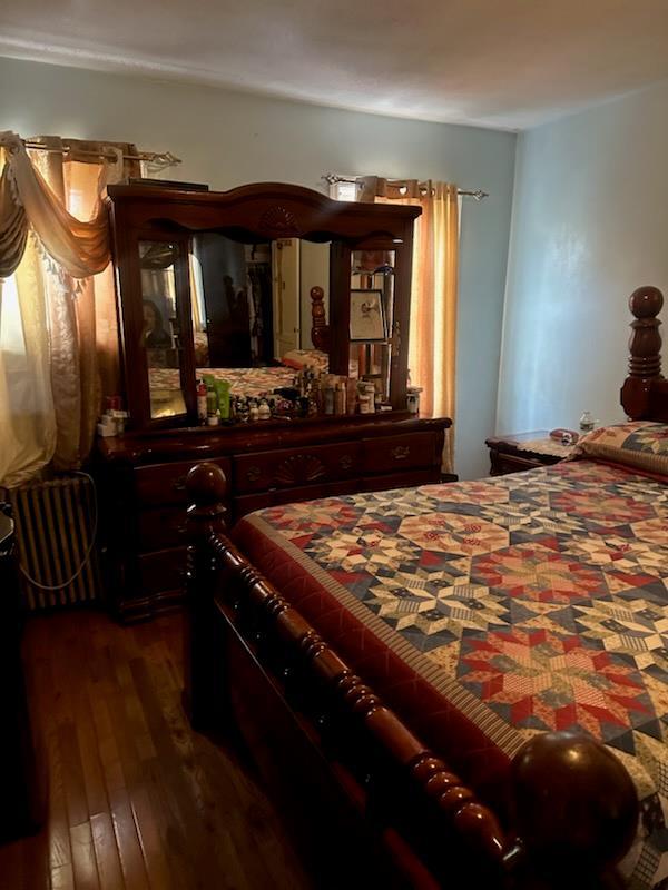 225-23 Murdock Ave, Queens Village, NY 11429 - bedroom featuring dark wood-style flooring