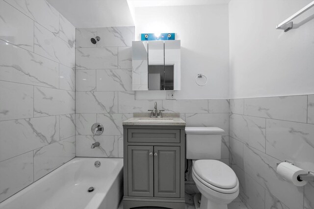 104-65 42nd Ave, Corona, NY 11368 - bathroom featuring vanity, tile walls, toilet, and shower / washtub combination