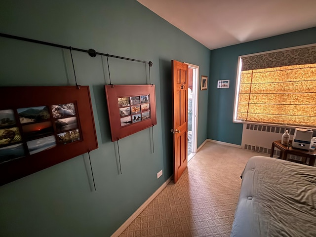 67-66 108th St Unit B64, Forest Hills, NY 11375 - bedroom featuring radiator, baseboards, and lofted ceiling