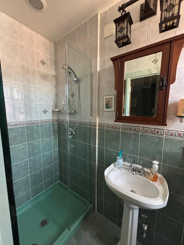 67-66 108th St Unit B64, Forest Hills, NY 11375 - bathroom with tile walls and a stall shower