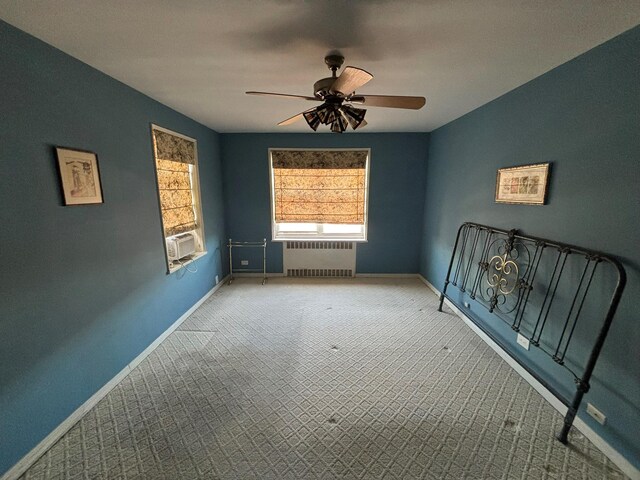 67-66 108th St Unit B64, Forest Hills, NY 11375 - unfurnished room with cooling unit, a ceiling fan, radiator heating unit, and baseboards