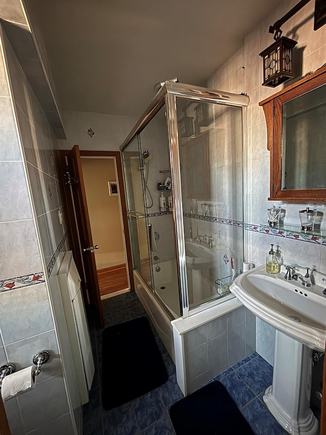 67-66 108th St Unit B64, Forest Hills, NY 11375 - full bathroom featuring tile patterned flooring, visible vents, tiled shower, and tile walls